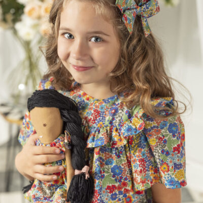 girl with a handmade doll