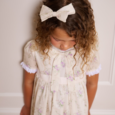 girl wearing floral hair bow made with liberty cotton