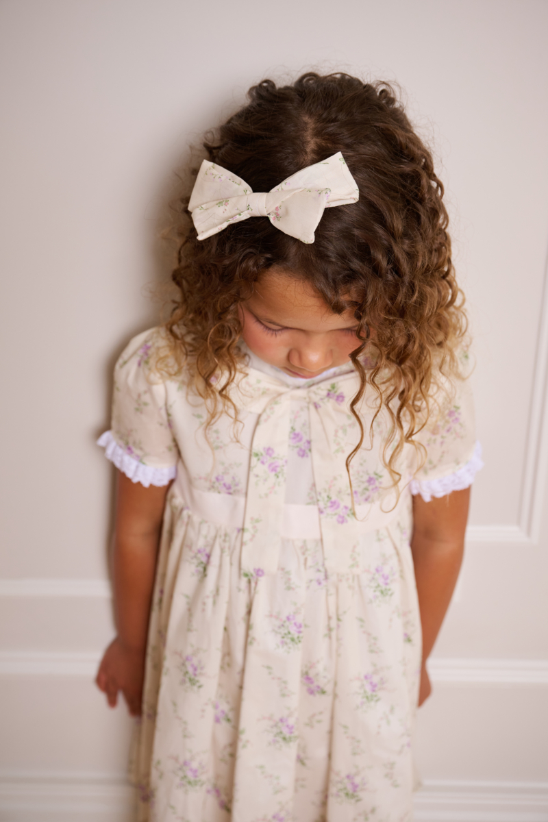 girl wearing floral hair bow made with liberty cotton