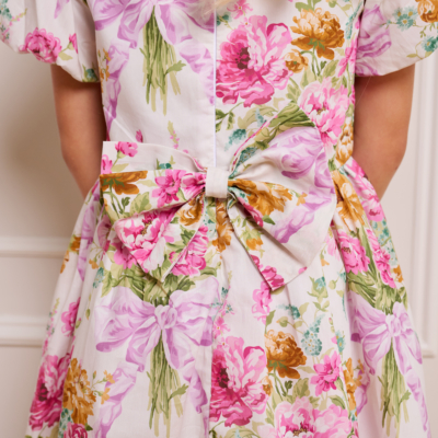 bow at the back of traditional floral pink childrens dress