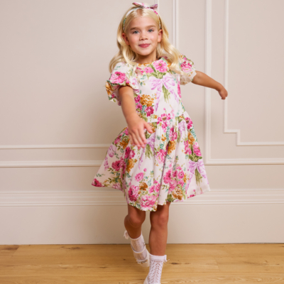 girl spinning in floral pink childrens dress bridgerton inspired