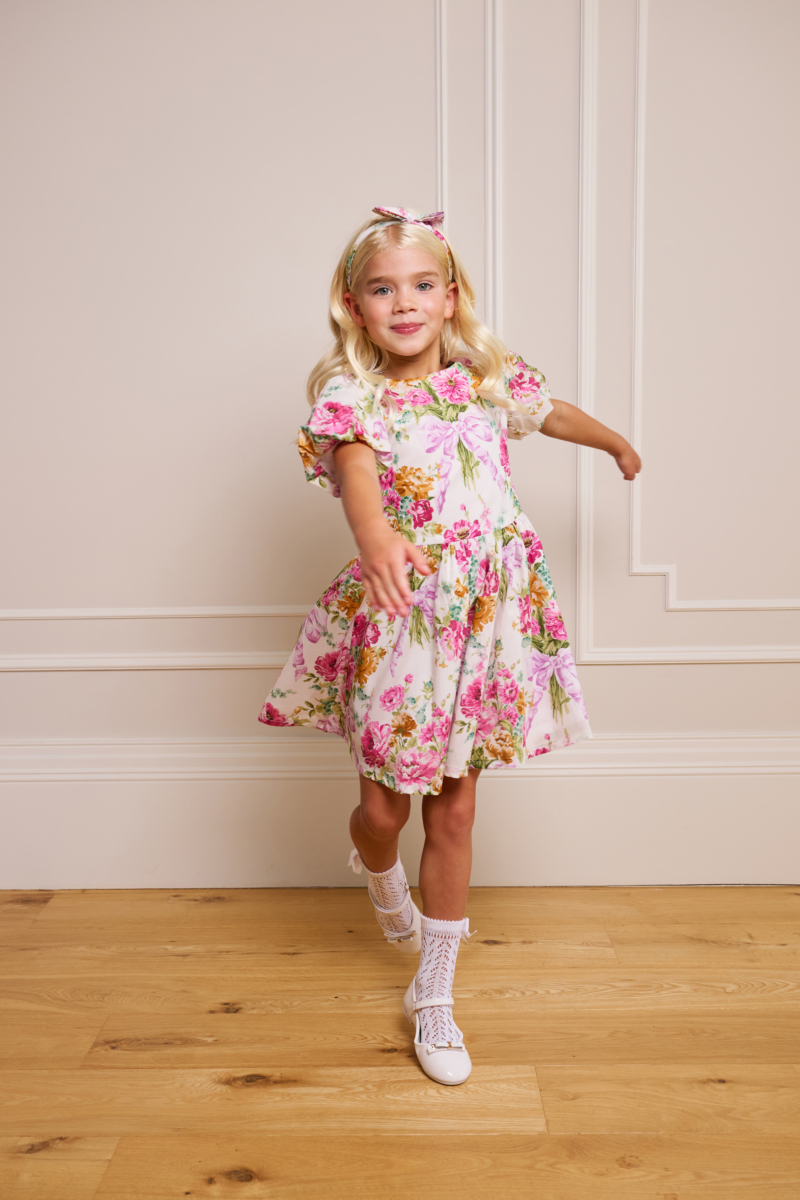 girl spinning in floral pink childrens dress bridgerton inspired