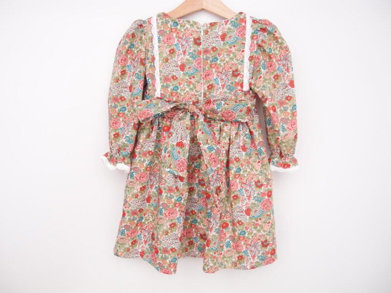 back of toddler girl dress with long sleeves and sash tieable bow liberty fabric