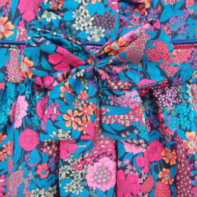 bow at the front of baby girl dress navy color pink flowers liberty fabric